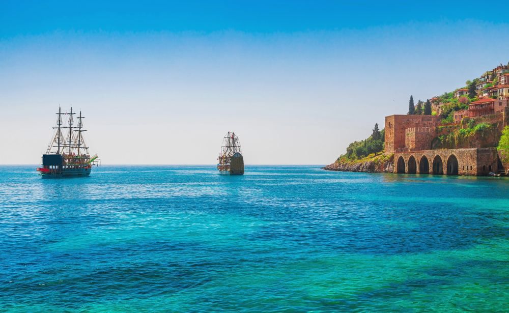 Cellulitis Treatment in Avsallar | Online Prescription | Pirate boats in the bay with the Alanya shipyard and castle hill | E-rx.online