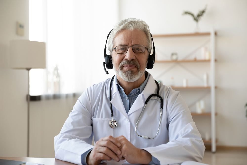 Need a Doctor in Levent? Video Consultation and | Online Prescription | Doctor wearing a headset during a video consultation | E-rx.online