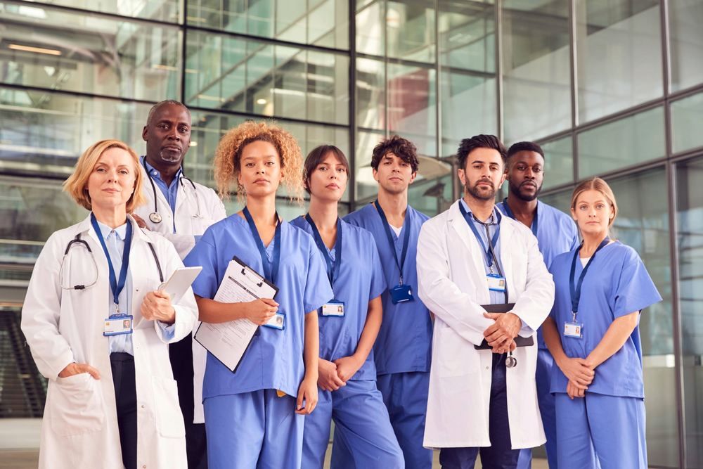 Team of doctors and nurses standing in a hospital lobby | Find a Doctor in Turkey | Online Doctor | E-rx.online